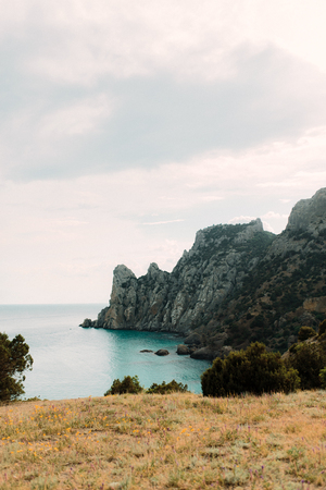 Sunset on the mountain near the sea.Top of rocky mountainの写真素材