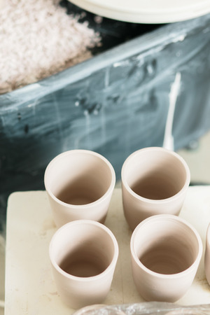 ceramic mug made on a Potter's wheel in the studio. Workshop on modeling on the potter's wheel.の写真素材