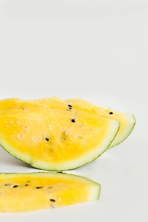 ripe yellow watermelon on white background, summer foodの写真素材