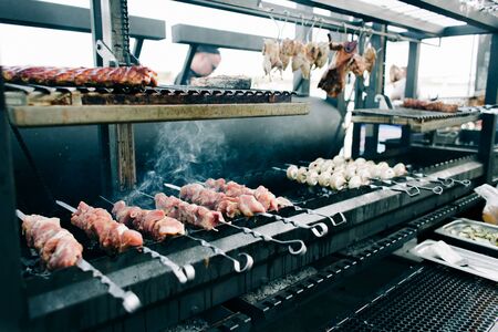 barbecue on skewers of fried meat and mushroomsの写真素材