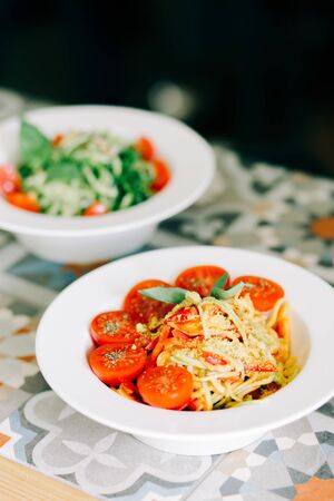raw zucchini paste with tomatoes and Basil. raw food.の写真素材