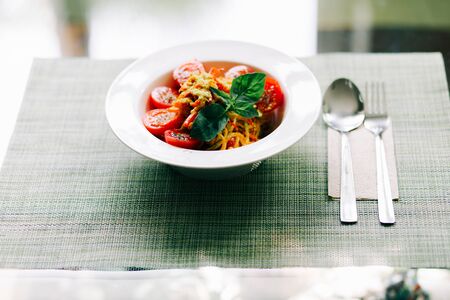 raw zucchini paste with tomatoes and Basil. raw food.の写真素材