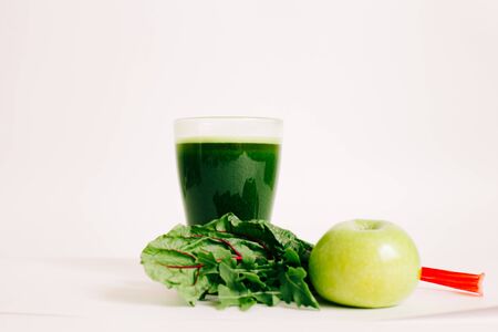 green freshly squeezed juice from green Apple and young beet leavesの写真素材