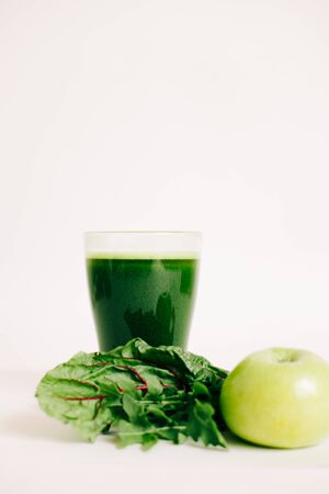 green freshly squeezed juice from green Apple and young beet leavesの写真素材