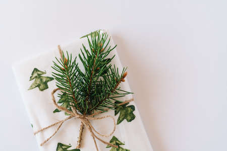 Christmas or new year's background, plain composition of Christmas gifts and fir branches, Flatlay, empty space for greeting text.の写真素材