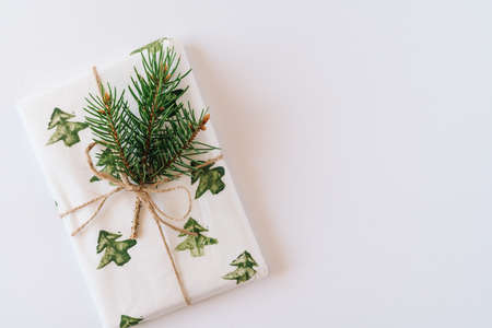 Christmas or new year's background, plain composition of Christmas gifts and fir branches, Flatlay, empty space for greeting text.の写真素材