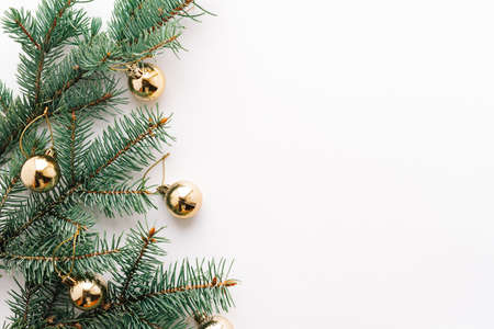 Christmas or new year's background, plain composition of Christmas golden toys and fir branches, Flatlay, empty space for greeting text.christmas concept.の写真素材