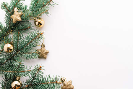 Christmas or new year's background, plain composition of Christmas golden toys and fir branches, Flatlay, empty space for greeting text.christmas concept.の写真素材