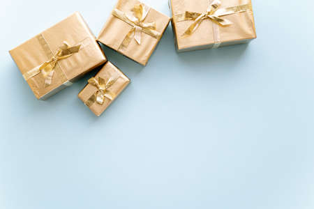 Golden Christmas or new year's background, plain composition of golden Christmas gifts. Flatlay,...