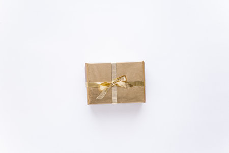 White Christmas or new years background, plain composition of golden Christmas gifts. Flatlay, empty...
