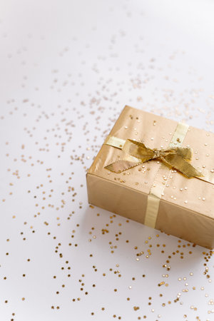 white Christmas or new years background, plain composition of golden Christmas gifts with golden stars. Flatlay, empty space for greeting text.christmas concept.の写真素材