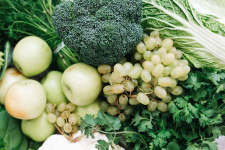 background of fresh green healthy fruits and vegetables.の写真素材