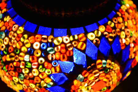 An unusual shade made of multicolored mosaics, colored beads and bright glass is located in the Turkish national lamp.の写真素材