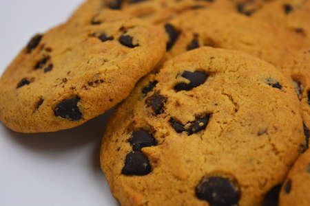 Very sweet shortbread cookie with chocolate pieces located on a white background. Ukrainian popular...