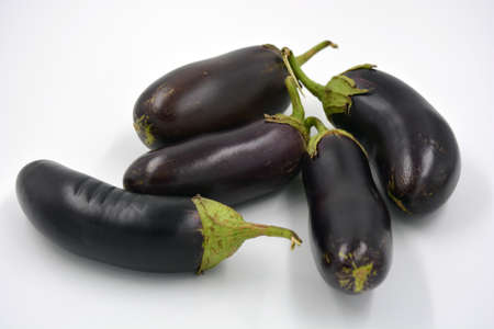 Fresh and healthy vegetables from breast, blue, purple eggplants located on a white background.の写真素材
