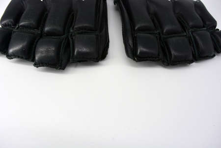 Sports equipment, equipment, things for sports, boxing, karate. Stylish beautiful fashionable black boxing gloves made of genuine leather. Combat men's gloves with an interesting structure and fashionの写真素材