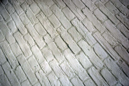 An interesting extravagant backdrop of uneven structural bricks with rough joints between them.