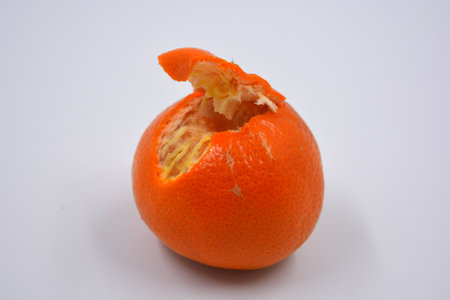 Ripe peeled orange tangerine, sweet fruit with orange skin located on a white background in different positions.の写真素材