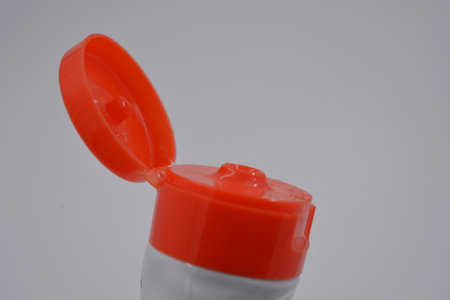 Close-up of a plastic bottle of detergent on white background. Medicine, hygiene products, home...