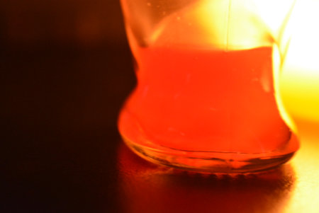 Close up shot of an hourglass on a dark background. Selective focus. Beautiful glass vessel in the...
