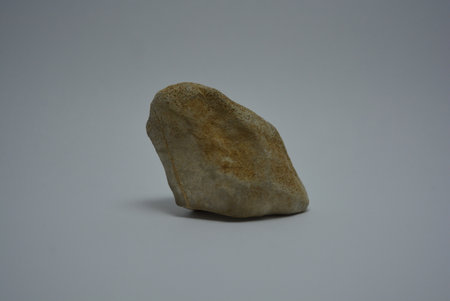 Interesting and unusual stones from the street and the sea are arranged on a white background.の写真素材