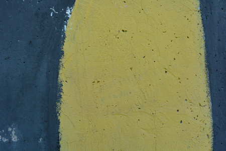 Yellow and blue painted concrete wall texture. Abstract background for design. Colored chaotic patterns, lines are blue, black, yellow.の写真素材