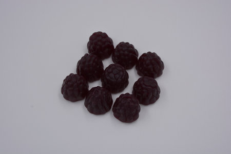 Blackberry, blackberries on a white background. Black jelly blackberry, raspberry are arranged on a...