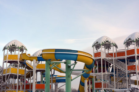 Children's water park in the city park on a sunny winter day. Beautiful water yellow, blue, colored...