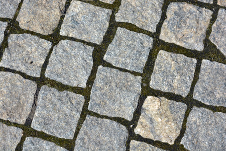 Detailed close up view on cobblestone street textures in high resolution. Beautiful stones, gray cobblestones, gray stones laid out textured on the ground, masonry with stones.の写真素材