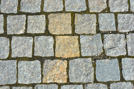 Beautiful stones, gray cobblestones, gray stones laid out textured on the ground, masonry with stones.の写真素材