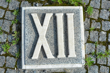 White inscriptions in gray granite of Roman numerals.の写真素材