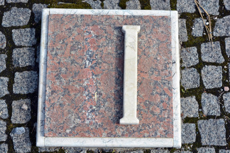The letter I on the stone floor of the cemetery. White inscriptions in gray granite of Roman numerals one, two, three, four, five, six, seven, eight, nine and ten.の写真素材