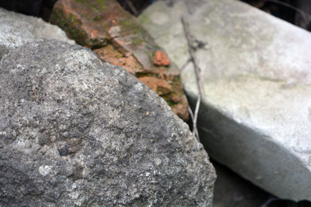 Building materials, an unusual background of stones, ruins. Light white, brown stones, bricks, construction debris, broken building bricks.の写真素材