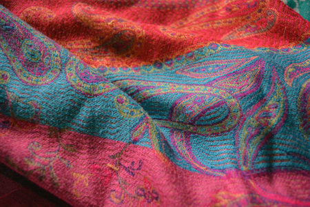 Thai silk fabric texture background. Close up of colorful fabric. Pink, blue, red and purple,...