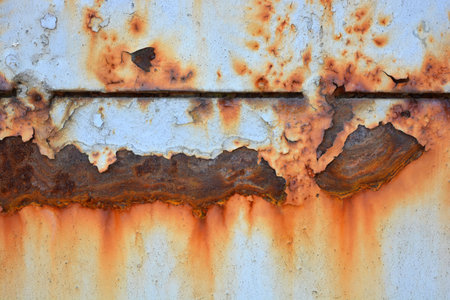 Unusual backgrounds, old, rusty building materials. Metallic background made of black metal, covered...