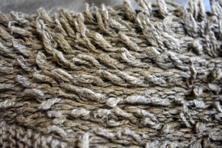 Woolen fabric texture background. Close up of brown woolen fabric texture. Women's clothing, stylish...
