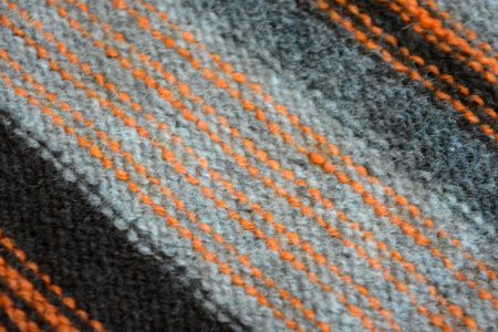 Knitted wool fabric texture. Abstract background and texture for design. A men's sweater is made in...