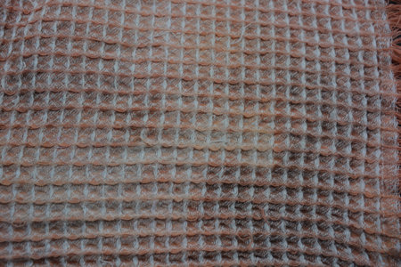 Soft fabrics, things, black and white bleached cotton napkin are located on a black plastic...