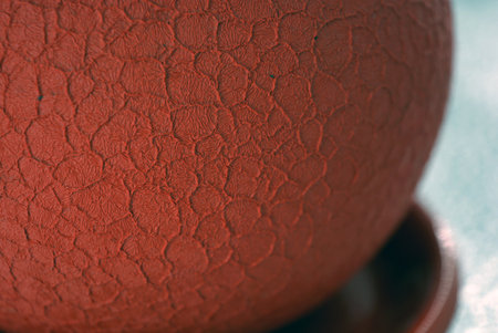 Close-up of an ancient vase with red paint on it.の写真素材