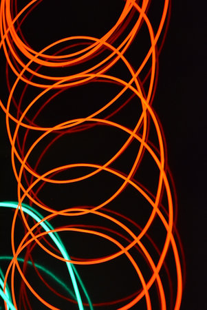 Abstract background with colorful neon lights. Long exposure photo of neon. Glowing blue and red...