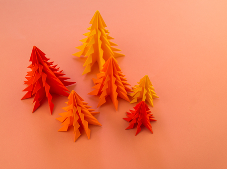 Multicolored paper Christmas tree on a pink background. Christmas holiday. Children's holiday.の写真素材