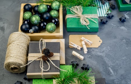 Packing of new kraft paper of the New Year and Christmas gift, green and black. Material for decorating the holiday. Natural decor in the style of eco-style.の写真素材
