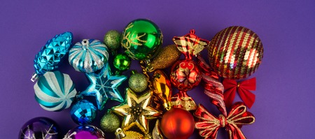Colorful christmas baubles in rainbow. Brilliant toys for decorating the Christmas tree. Christmas mood holiday.の写真素材