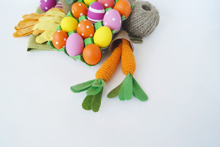 Decorative Easter composition. Birdhouse and Easter eggs. Flowerpots. Spring. Easter eggs are orange...