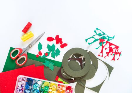 New Year felt wreath. Christmas decor. A toy made of cloth. Decorative ornaments and tools.