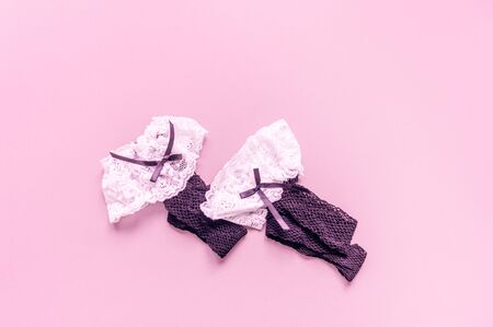 Stockings black female mesh. Pink background. Toys for adults. Sex isolate