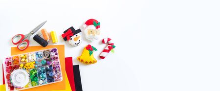 We sew a toy snowman made of felt. Christmas symbol. Material for decorating. Mastery is creativity. Copy spaceの写真素材