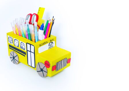 School bus made of cardboard. DIY children's pencil case for stationery paper craft. Back to school....