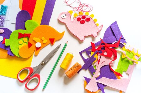 Craft from felt instruction for creating a dinosaur toy. Material for creativity.Favorite cozy hobby