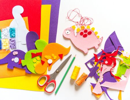 Craft from felt instruction for creating a dinosaur toy. Material for creativity.Favorite cozy hobby